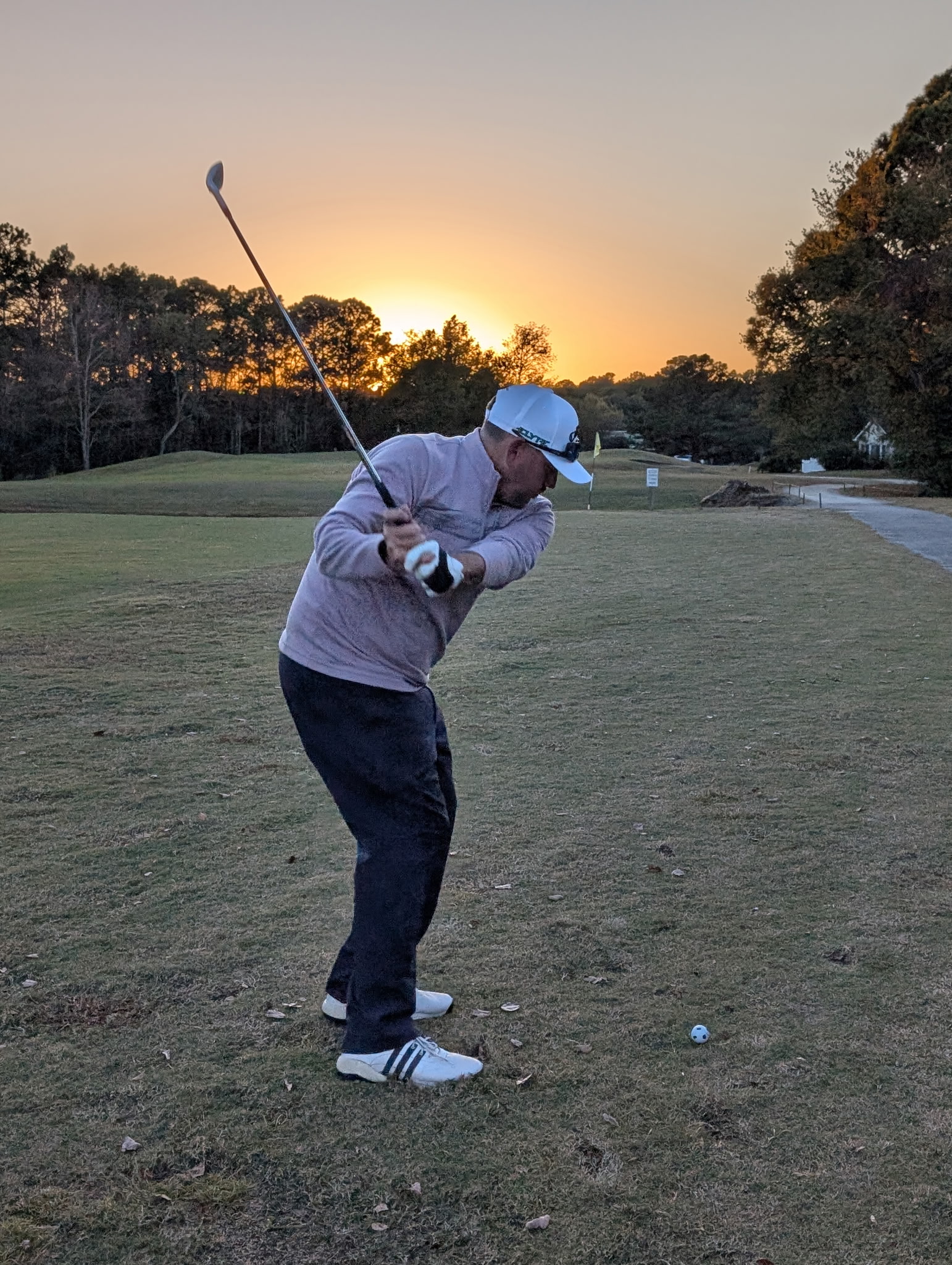 Picture of head pro hitting approach shot on 13.